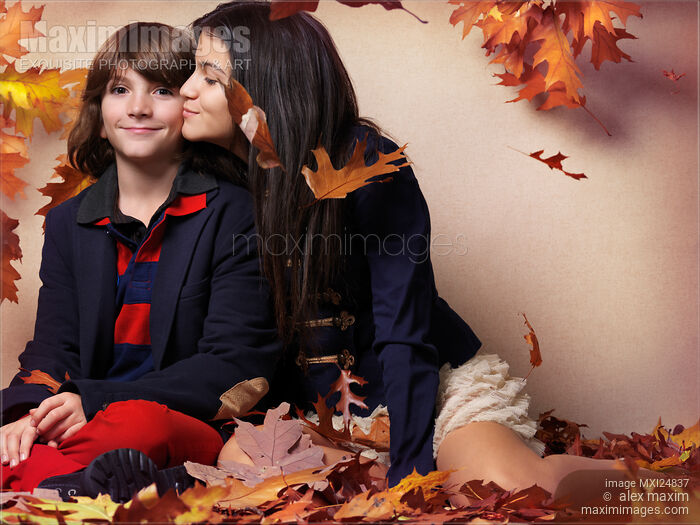 Teenage girl kissing a boy artistic fall fashion photo Stock photo of Teenage girl kissing a boy artistic fall fashion photo Buy commercial use license at MaximImages