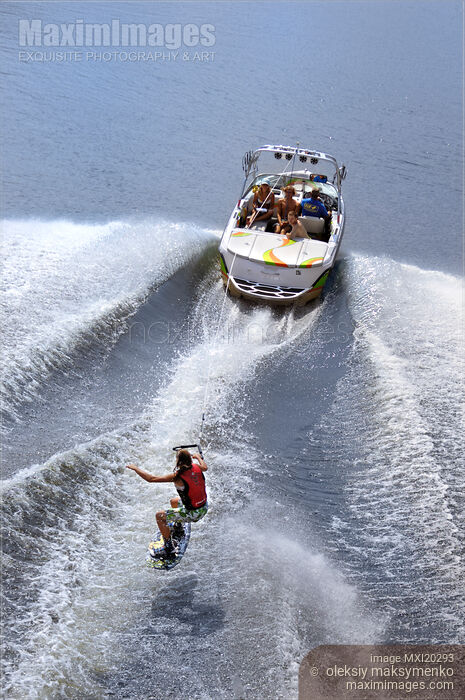 Stock photo of Teenage Girl Riding Wakeboard Buy commercial use license at MaximImages