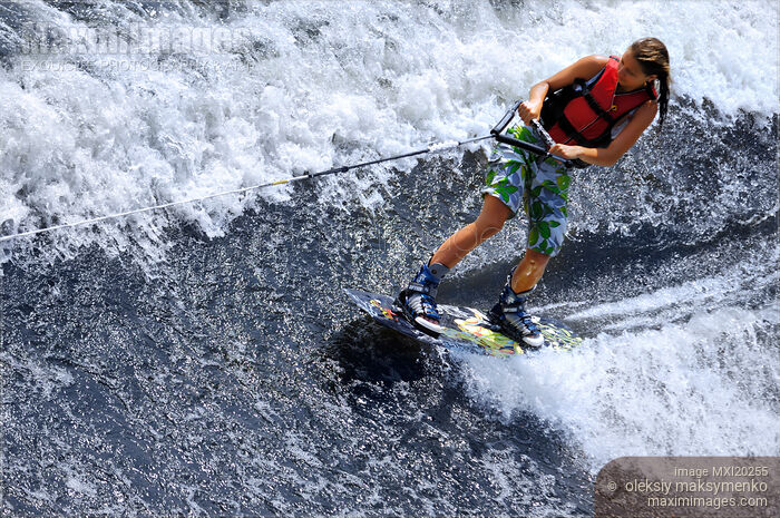 Stock photo of Teenage Girl Wakeboarding Buy commercial use license at MaximImages
