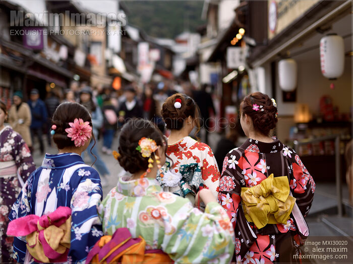 Stock photo of Teenage girls in colorful kimono walking on Matsubara dori street in Kyoto near Kiyomizu-dera Buy commercial use license at MaximImages