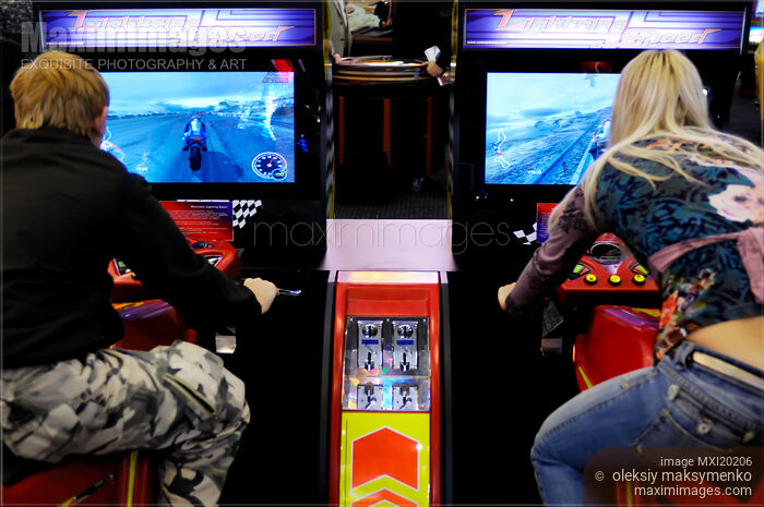Stock photo of Teenagers on Motorcycle Ride Slot Machines Buy commercial use license at MaximImages