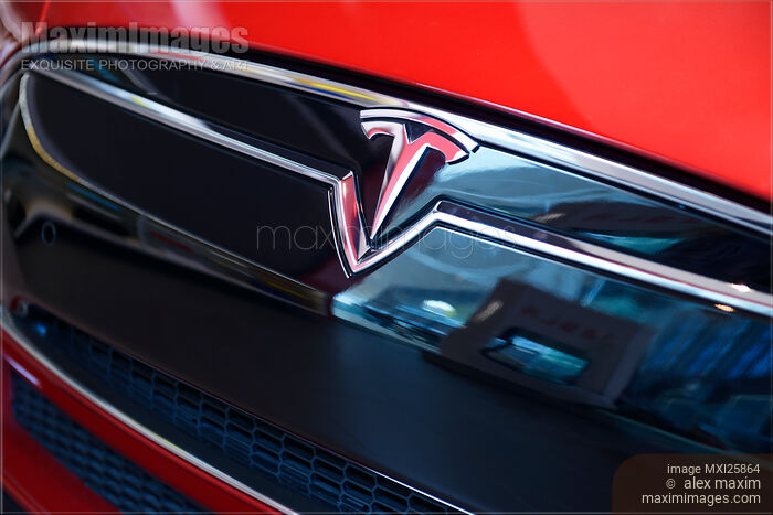 Tesla Motors Emblem on a car closeup Stock photo of Tesla Motors Emblem on a car closeup Buy commercial use license at MaximImages