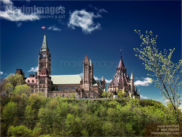 Stock photo of The Parliament Hill in Ottawa Canada over deep blue sky Buy commercial use license at MaximImages