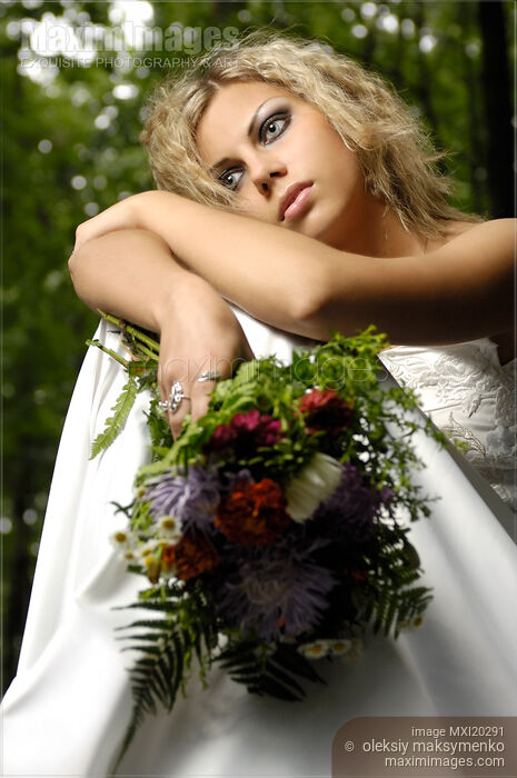 Stock photo of Thoughtful Lonely Young Bride in Wedding Dress Buy commercial use license at MaximImages