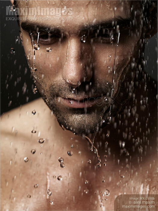 Thoughtful man face under pouring water Stock photo of Thoughtful man face under pouring water Buy commercial use license at MaximImages