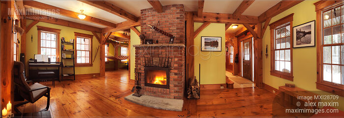 Stock photo of Timber frame Canadian house interior living room with fireplace Buy commercial use license at MaximImages
