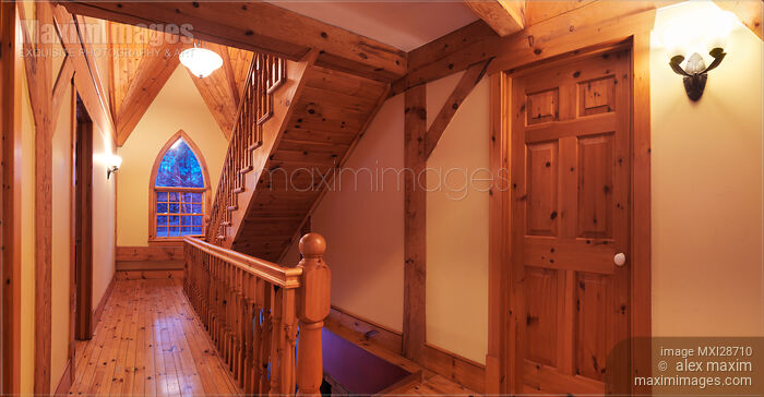 Timber frame cottage style Canadian house hall with wooden staircase Stock photo of Timber frame cottage style Canadian house hall with wooden staircase Buy commercial use license at MaximImages