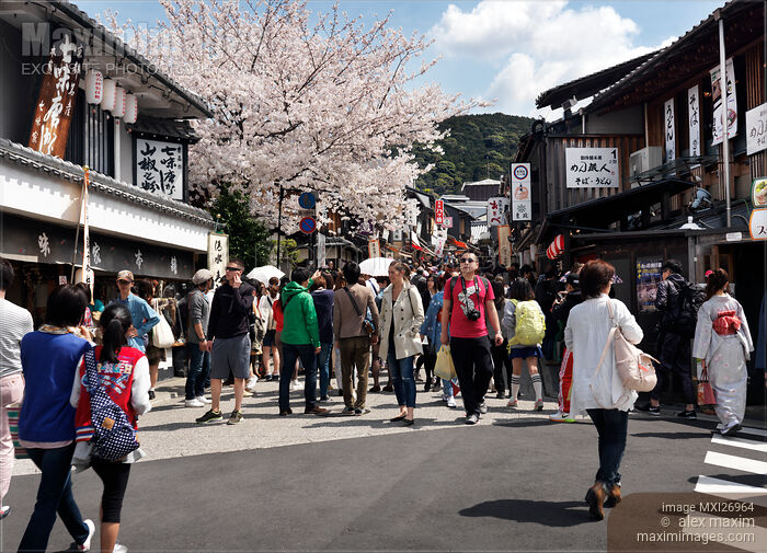 Tourists on Matsubara dori street in Kyoto Stock photo of Tourists on Matsubara dori street in Kyoto Buy commercial use license at MaximImages
