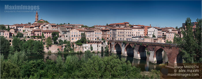 Town of Albi panorama with buildings along river Tarn and old bridge Pont Vieux South France Stock photo of Town of Albi panorama with buildings along river Tarn and old bridge Pont Vieux South France Buy commercial use license at MaximImages