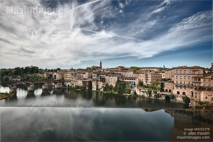 Town of Albi South of France Artistic dramatic scenery of historic buildings along the banks of river Tarn Stock photo of Town of Albi South of France Artistic dramatic scenery of historic buildings along the banks of river Tarn Buy commercial use license at MaximImages