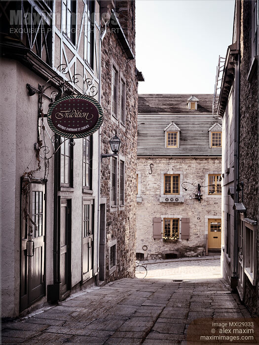 Tradition boutique store sign in a small historic street of Old Quebec City Stock photo of Tradition boutique store sign in a small historic street of Old Quebec City Buy commercial use license at MaximImages