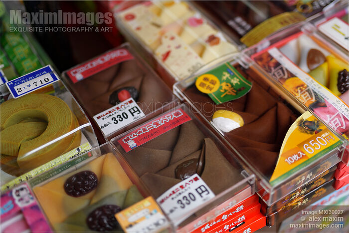 Traditional Japanese confectionery Yatsuhashi triangles and Baumkuchen rice cake on store display Stock photo of Traditional Japanese confectionery Yatsuhashi triangles and Baumkuchen rice cake on store display Buy commercial use license at MaximImages