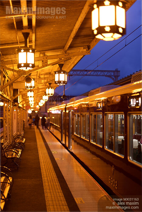 Stock photo of Train at Hankyu Arashiyama station platform at night in Kyoto Buy commercial use license at MaximImages