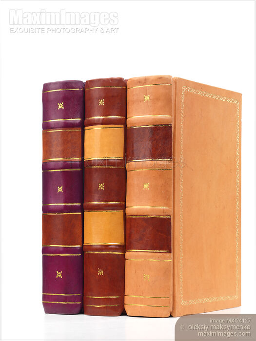 Stock photo of Tree hardcover leather bound books Buy commercial use license at MaximImages