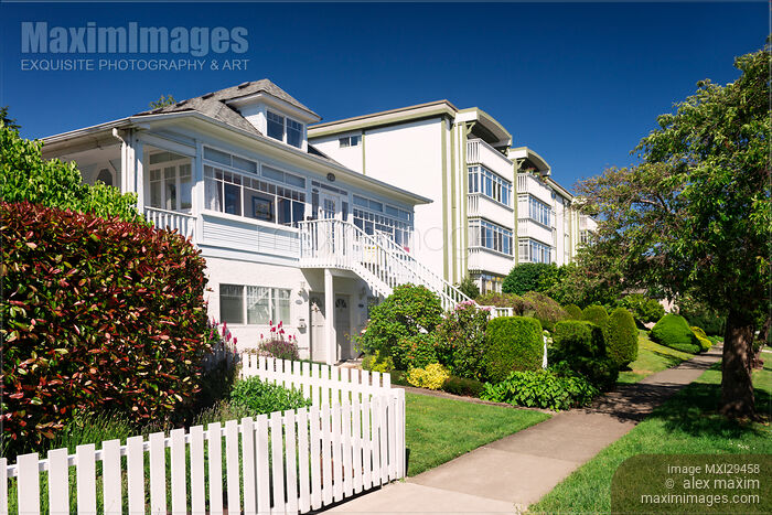 Stock photo of Triplex house and apartment building in Victoria BC on a summer day Buy commercial use license at MaximImages