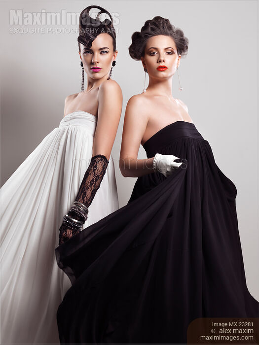 Two Beautiful Women in Long Dresses Stock photo of Two Beautiful Women in Long Dresses Buy commercial use license at MaximImages