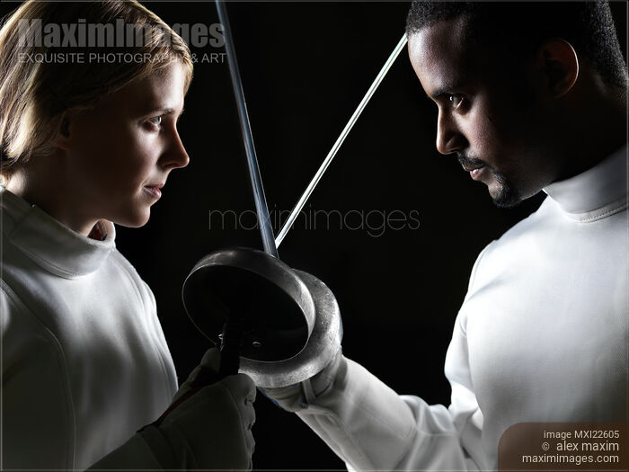 Stock photo of Two Fencers with Crossed Weapons Buy commercial use license at MaximImages