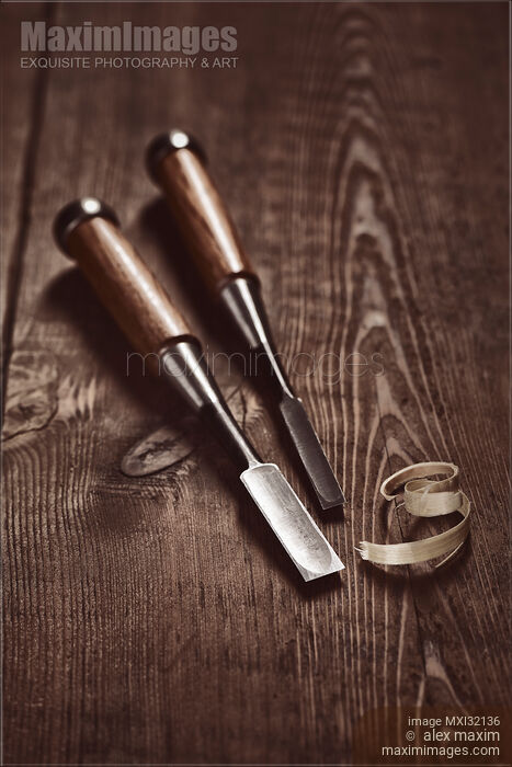 Stock photo of Two Japanese Tataki chisels and wood shavings on a table Carpentry still life Buy commercial use license at MaximImages