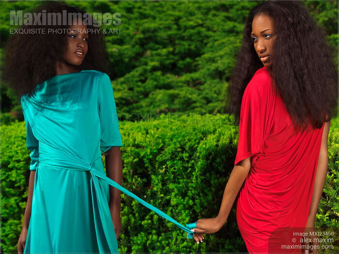Two Women Wearing Bright Dresses in a Park Stock photo of Two Women Wearing Bright Dresses in a Park Buy commercial use license at MaximImages