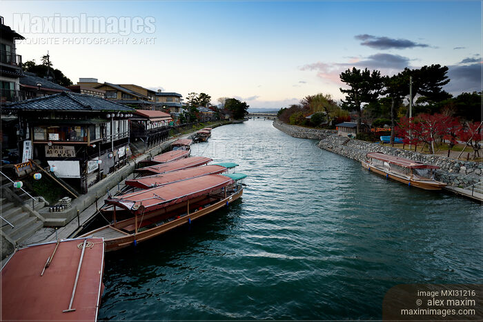 Stock photo of Uji city scenery of sightseeing pleasure cruise boats on Uji River Buy commercial use license at MaximImages