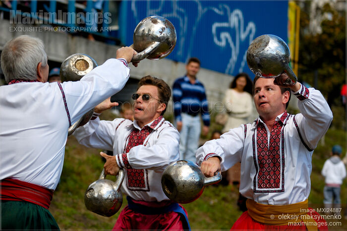 Stock photo of Ukrainian athletes juggling kettlebells Buy commercial use license at MaximImages