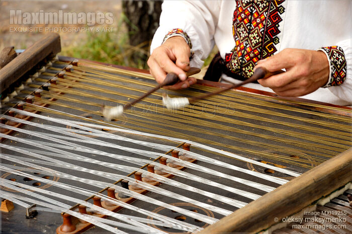 Ukrainian Musician Playing Dulcimer Stock photo of Ukrainian Musician Playing Dulcimer Buy commercial use license at MaximImages