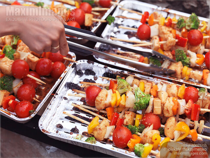 Stock photo of Vegetarian skewers cooking on fire Buy commercial use license at MaximImages