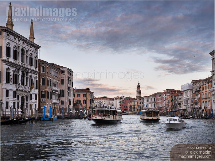 Venice Grand Canal with beautiful historic Venetian architecture and Vaporetto water buses Stock photo of Venice Grand Canal with beautiful historic Venetian architecture and Vaporetto water buses Buy commercial use license at MaximImages