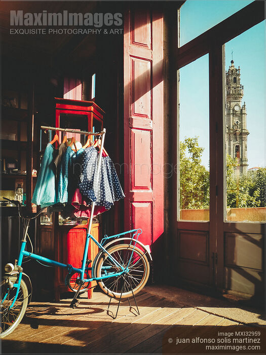 Stock photo of View of The Clerigos Church tower in Porto Portugal in a vintage store window Buy commercial use license at MaximImages
