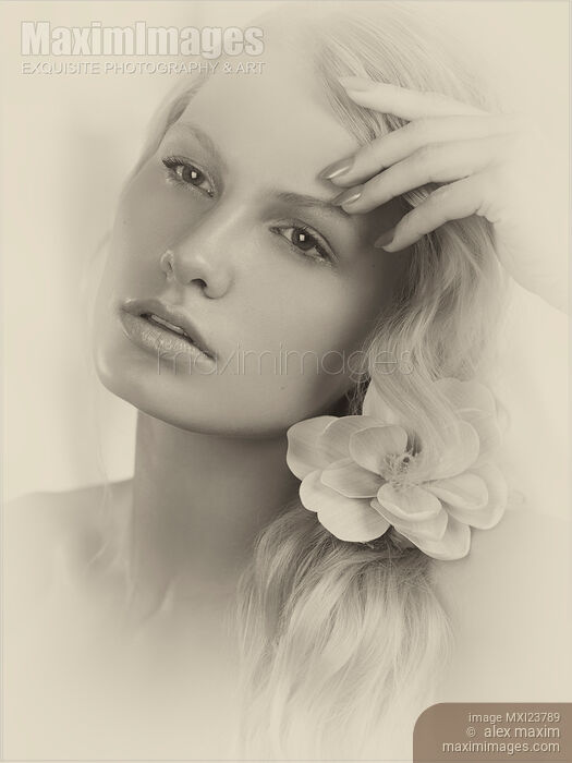 Vintage Portrait of a Beautiful Young Woman Stock photo of Vintage Portrait of a Beautiful Young Woman Buy commercial use license at MaximImages