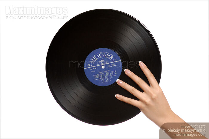 Vinyl Record in Hand Stock photo of Vinyl Record in Hand Buy commercial use license at MaximImages