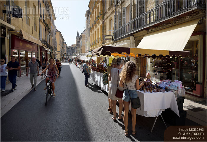 Stock photo of Visitors and vendors at street market in Aix-en-Provence South of France Buy commercial use license at MaximImages