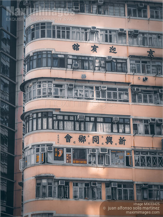 Wall of an urban residential high-rise building with balconies in Hong Kong Stock photo of Wall of an urban residential high-rise building with balconies in Hong Kong Buy commercial use license at MaximImages