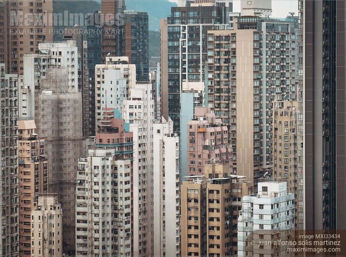 Stock photo of Wall of residential high-rise buildings in Hong Kong city China Buy commercial use license at MaximImages