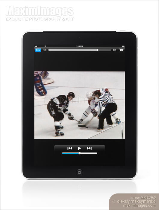 Stock photo of Watching Hockey Match on Apple iPad 3G Tablet Buy commercial use license at MaximImages