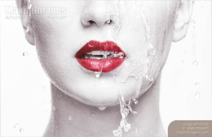 Water running over woman face closeup of lips with red lipstick Stock photo of Water running over woman face closeup of lips with red lipstick Buy commercial use license at MaximImages