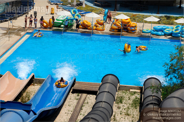 Stock photo of Waterpark pool and slides Buy commercial use license at MaximImages