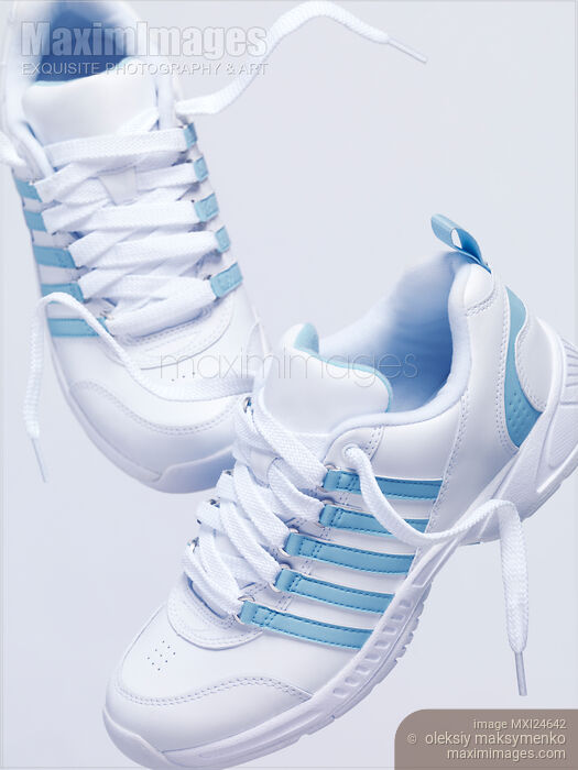 Stock photo of White running shoes artistic still life Buy commercial use license at MaximImages
