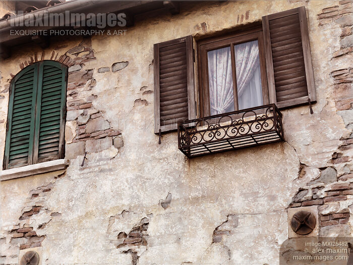 Stock photo of Windows of an old rustic house Buy commercial use license at MaximImages