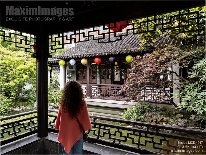 Stock photo of Woman at Lan Su Chinese Garden in Portland Oregon Buy commercial use license at MaximImages