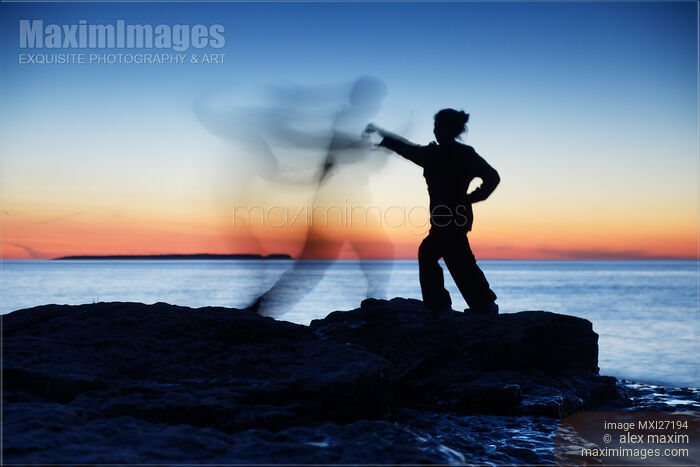 Woman attacking a ghost shadow of a man Stock photo of Woman attacking a ghost shadow of a man Buy commercial use license at MaximImages