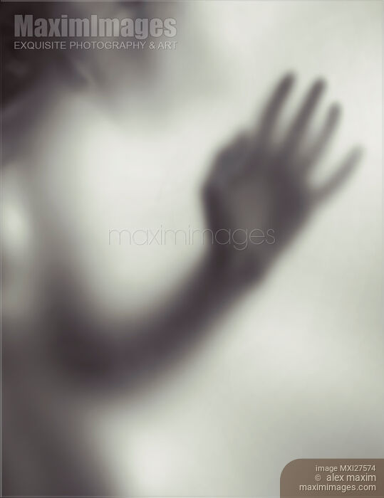 Woman blurred hand behind glass Stock photo of Woman blurred hand behind glass Buy commercial use license at MaximImages