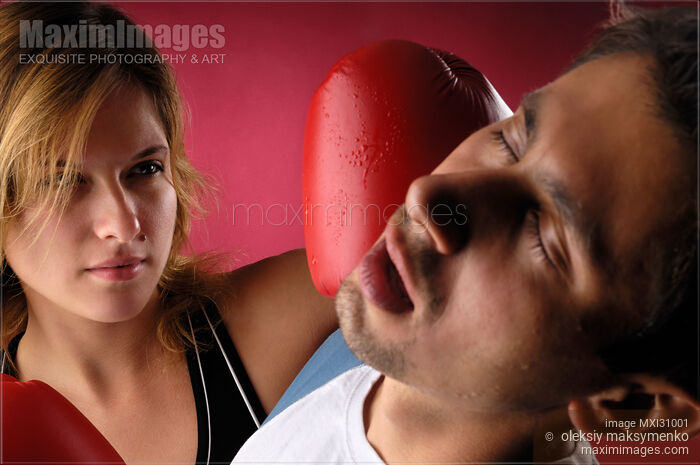 Stock photo of Woman Boxer Punching a Man Buy commercial use license at MaximImages