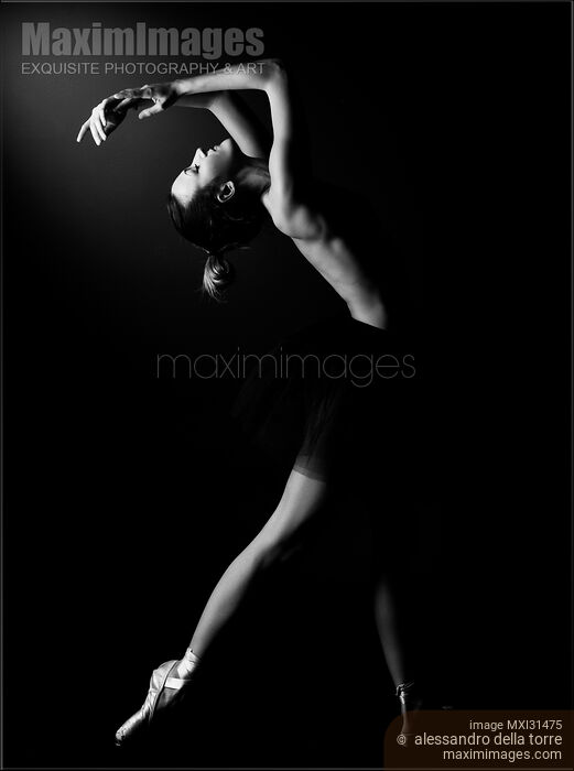 Woman dancer naked in a black tutu arching backwards Stock photo of Woman dancer naked in a black tutu arching backwards Buy commercial use license at MaximImages