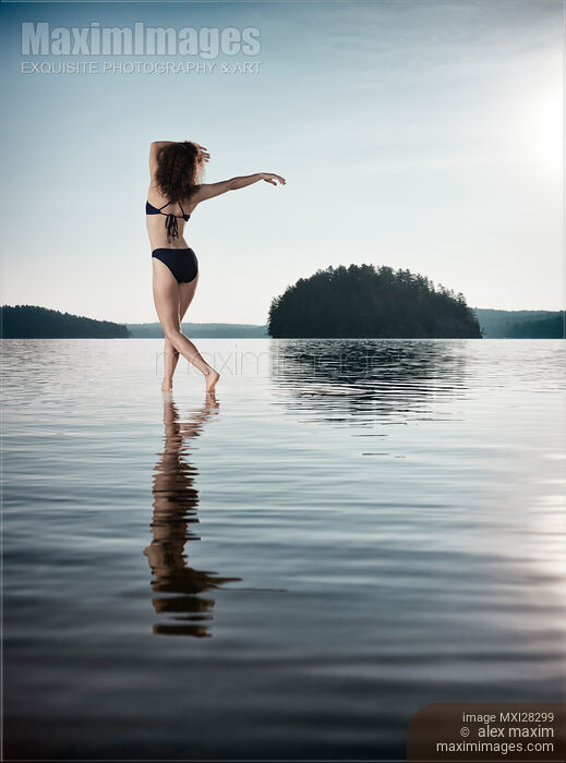 Stock photo of Woman dancing in morning sunlight in the nature Buy commercial use license at MaximImages