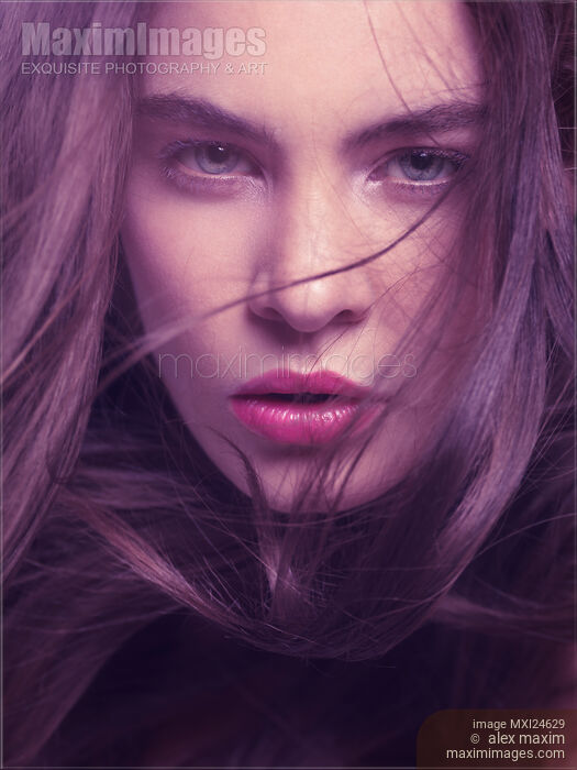 Stock photo of Woman face with flying hair beauty portrait Buy commercial use license at MaximImages