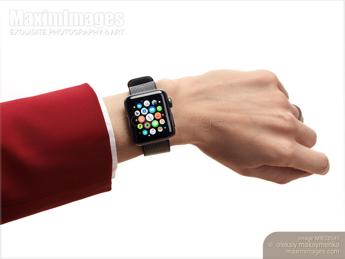 Stock photo of Woman hand with Apple Watch displaying app icons Buy commercial use license at MaximImages