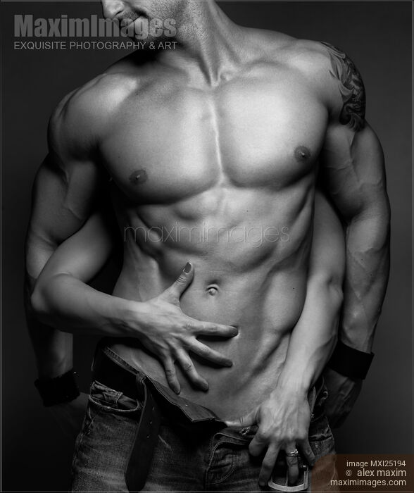 Woman hands touching muscular man's body Stock photo of Woman hands touching muscular man's body Buy commercial use license at MaximImages