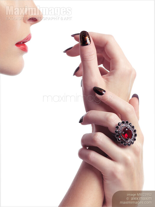 Woman Hands with Fancy Nail Polish and Red Lips Stock photo of Woman Hands with Fancy Nail Polish and Red Lips Buy commercial use license at MaximImages