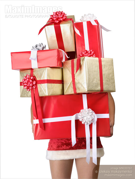 Woman holding a lot of Christmas gifts Stock photo of Woman holding a lot of Christmas gifts Buy commercial use license at MaximImages